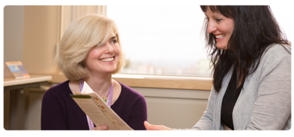 A social worker assists a client